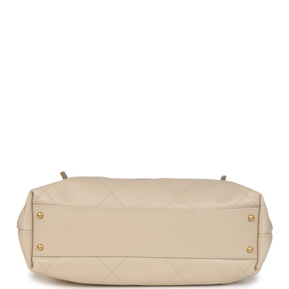 Chanel Maxi Coco Shopping Bag Beige Calfskin Antique Gold Hardware